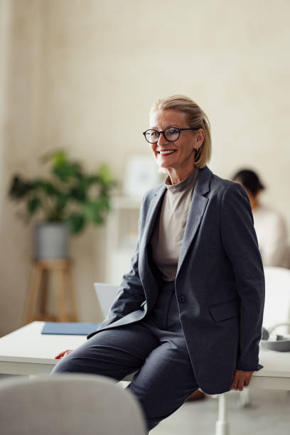 istock Confident Professional Woman Smiling in Modern Office Setting 2167466322
