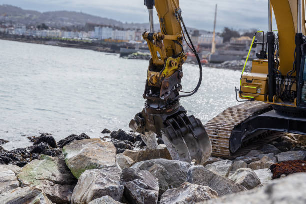 istock Excavator Placing Rocks on Coastal Shoreline 2167468497
