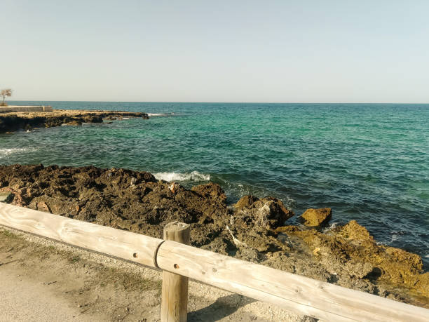istock Deserted rocky coast and calm sea 2167468586