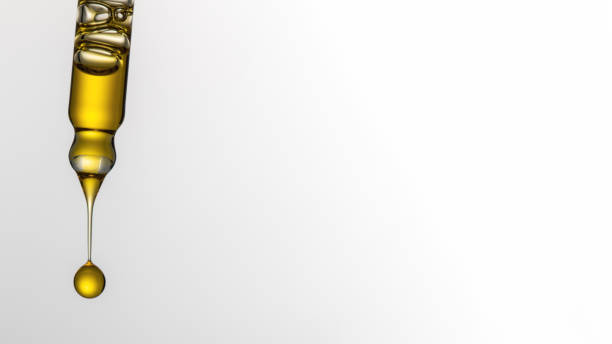 istock Dripping cosmetic serum from pipette on white background. Face serum. Copy space 2167478830
