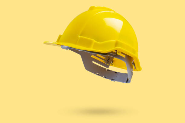 istock Safety construction helmet on yellow background 2167479378