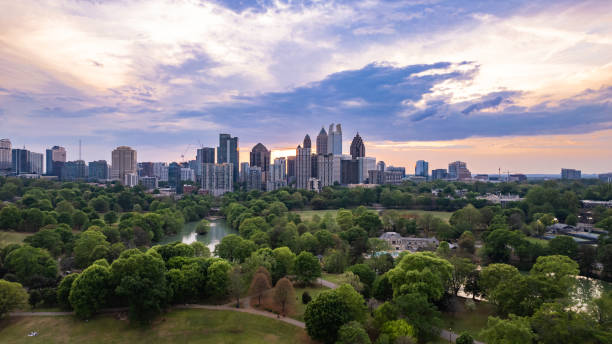 dramatic sunset over Atlanta skyline with park on a beautiful day