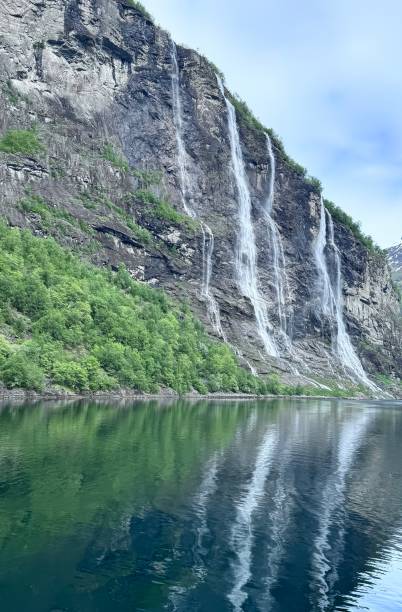 Triple Waterfalls Into The Fjord