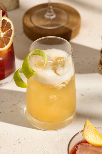 istock Refreshing Citrus Sour Cocktail with Lime Twist in Sunlit Setting 2167486798