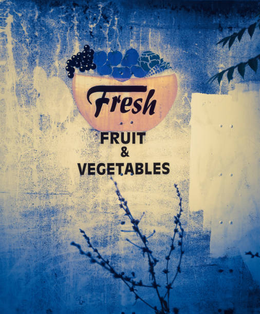 A fresh fruit and vegetables sign;