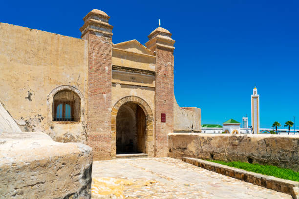 The city walls in Tangier, Morocco with the Mosque Lalla Aabla in the background.