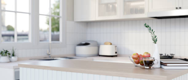 istock A wood kitchen island countertop in a modern minimalist white kitchen. 2167494958