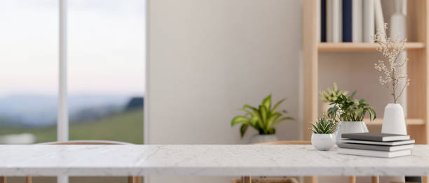 istock A minimalist, bright workspace features a white table with copy space for displaying products. 2167494980