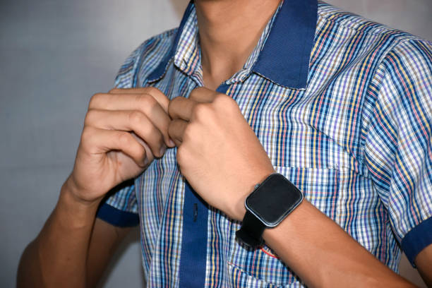 istock Indian school boy buttoning their dark blue school dress 2167495683