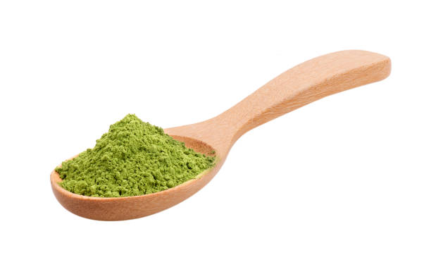 istock matcha green tea powder in wood spoon on white background 2167497928