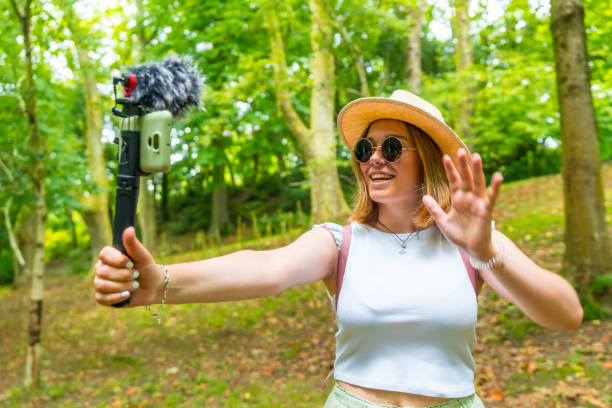 istock Young woman hiker recording vlog 2167506510
