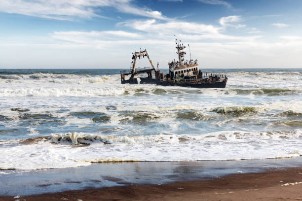 The rusty iron hulk of a fishing ship washed ashore in the Mediterranean Sea by a storm near Kibbutz HaBonim in northern Israel