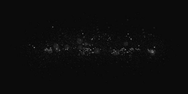 istock Luminous bokeh, softly shimmering with white light. Light abstract glowing lights. Glowing bokeh effect isolated on dark transparent background. Christmas background made of glowing dust. 2167507707