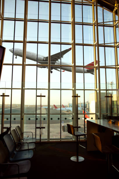 istock Empty airport terminal lounge with airplane on background 2167507761