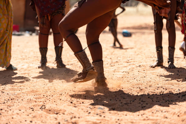 Himba women dancing at their village near Opuwo in Namibia, Africa
