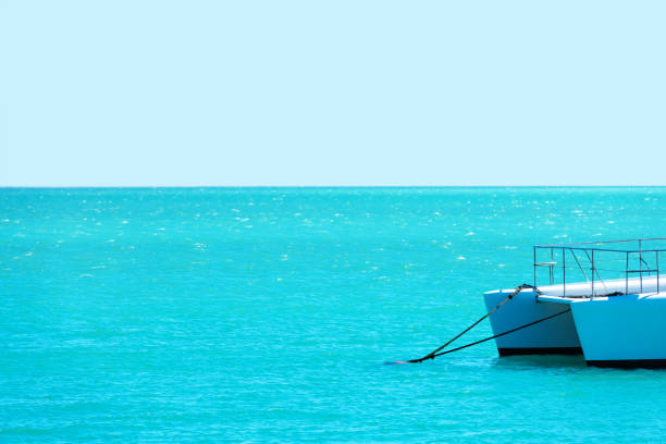 Perhentian Islands, Malaysia: An abandoned boat in clear tropical sea water.