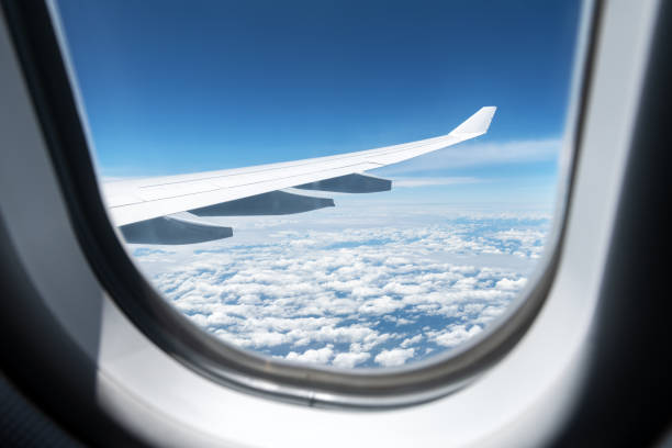istock View of clouds and wing from a plane window 2167509427