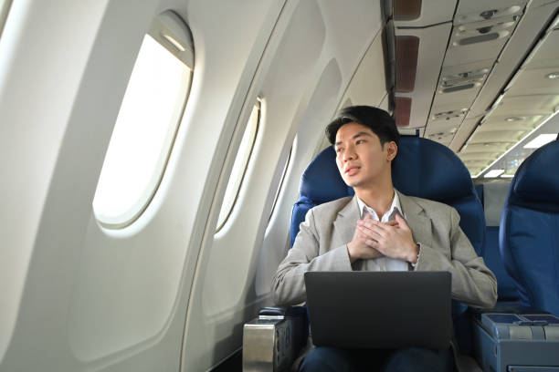istock Scared male passenger looking out the window, feeling terrified while traveling by plane 2167511411