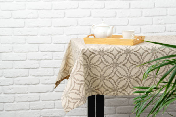 istock White Brick Wall With Beige Tablecloth and Basket 2167511695
