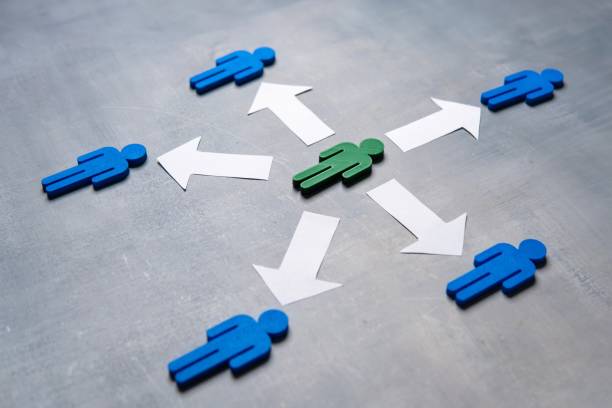 Green figure distributes tasks or responsibilities to others. A green figure at the center surrounded by blue figures with arrows. Delegation concept. Green figure distributes tasks or responsibilities to others. delegating stock pictures, royalty-free photos & images