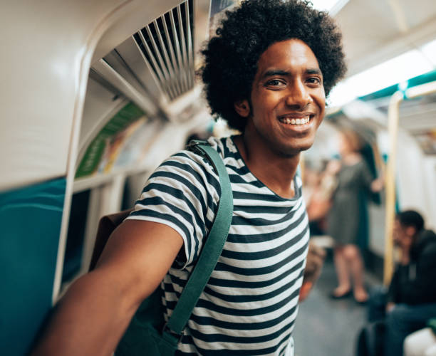 istock afro man inside the metro train waiting the stop 2167513634