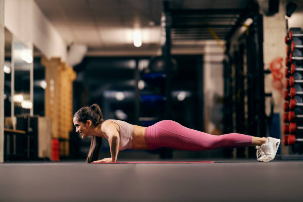 istock A strong sportswoman is practicing pushups in a gym. 2167515161