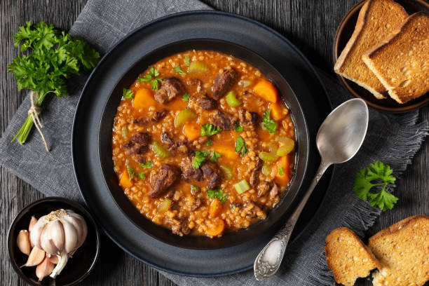 istock beef barley soup in a bowl, top view 2167515275