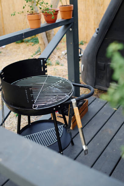 istock a forest adventure, BBQ beside camping van 2167517504