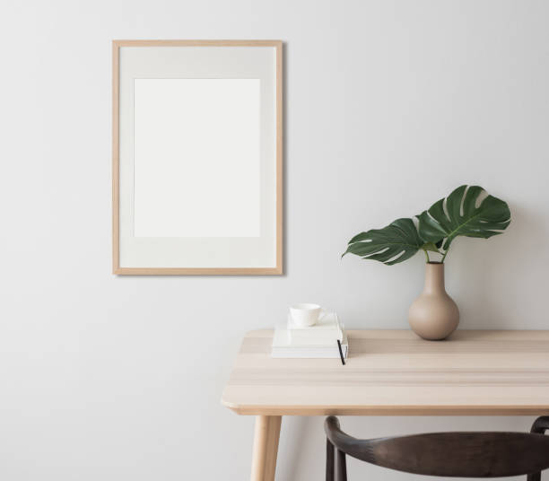 istock Frame artwork mockup in interior design. Blank picture frame on a wall. Vertical orientation 2167519004