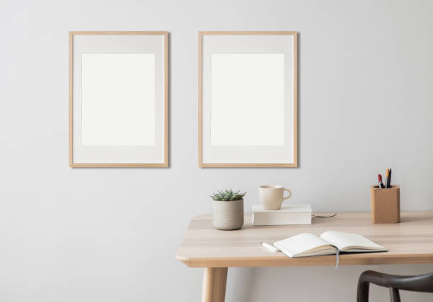 istock Frame artwork mockups in interior design. Blank picture frame on a wall. Vertical orientation 2167519009
