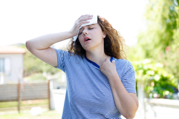 istock Young woman having hot flash and sweating in a warm summer day 2167520939