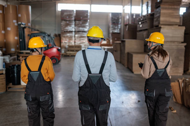 istock Paper factory workers inspecting products in a warehouse 2167521288