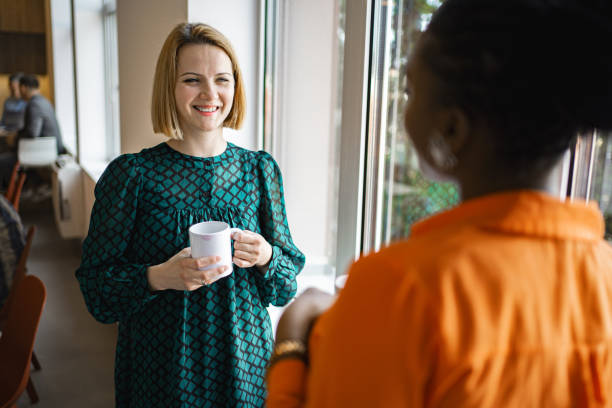 istock Two female colleagues having a coffee break at the office 2167521392