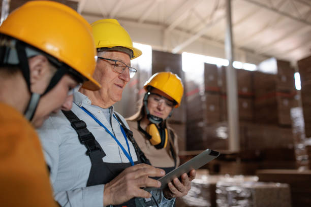 istock Paper factory workers inspecting products in a warehouse 2167521466