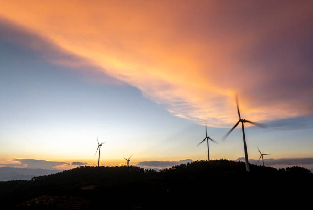 Wind turbines on top of a mountain under a beautiful morning sky in Fujian Province, China