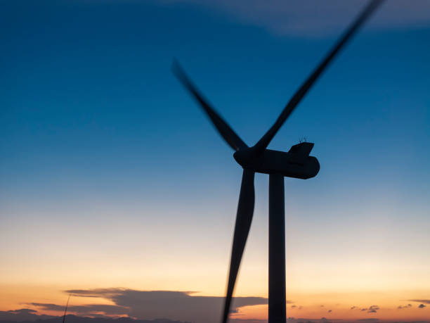 Wind turbines on top of a mountain under a beautiful morning sky in Fujian Province, China