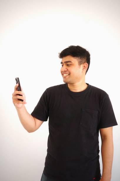 istock A man is happy while looking at his phone screen 2167525014