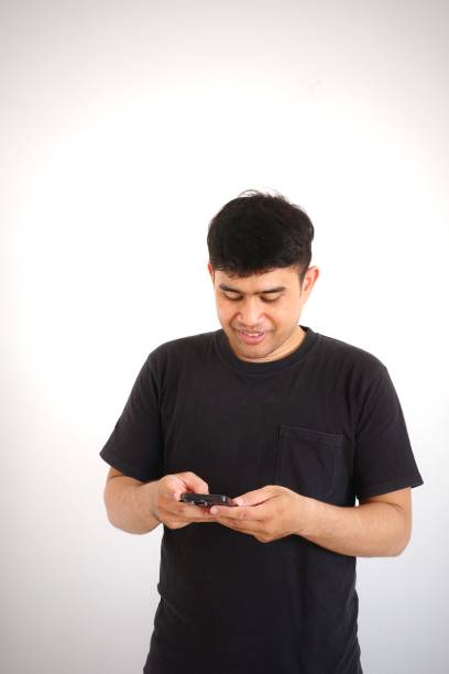 istock A man is happy while texting on his phone. 2167525035