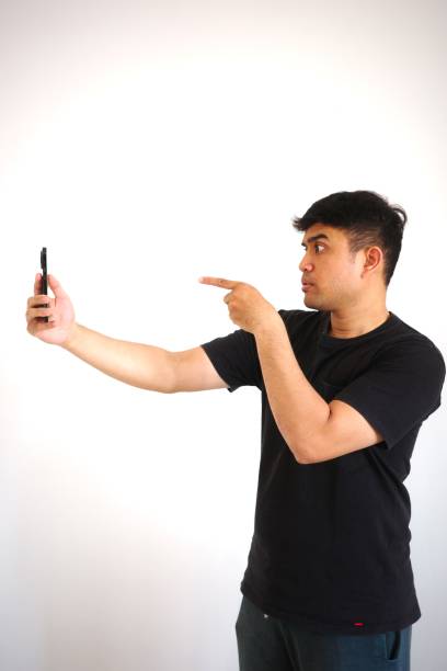 istock A man is angry and pointing his finger while on a video call 2167525059
