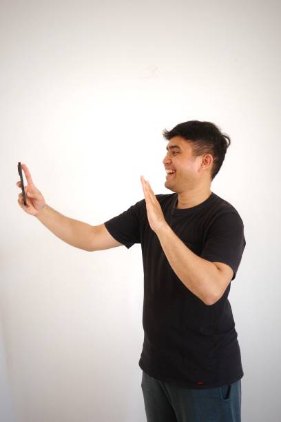 istock A man is happy while video call on his phone. 2167525063