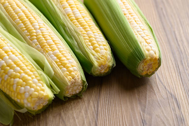 istock Fresh sweet corn (bicolor) on wooden background 2167525407