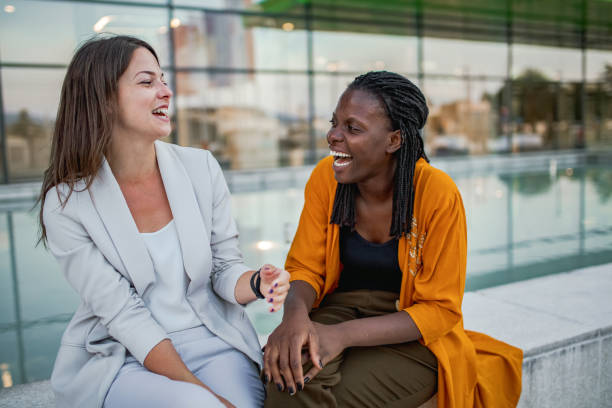 istock Two multiracial businesswomen outdoors talking after work 2167525816