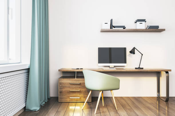 istock Modern home office with a wooden desk and computer. 3D Rendering 2167525825
