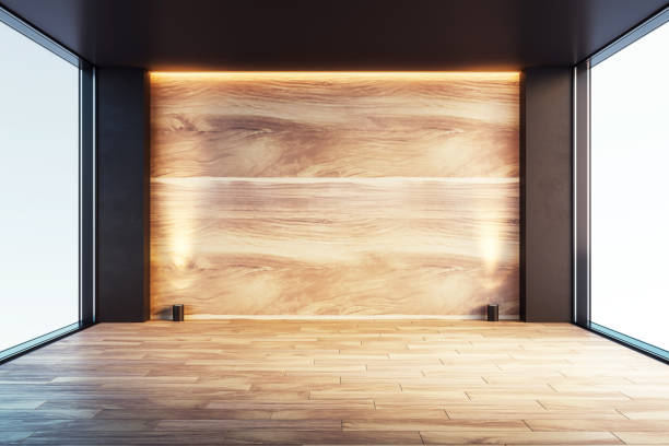 istock Modern empty room with wooden wall and floor, large windows, and ambient lighting. 3D Rendering 2167526853