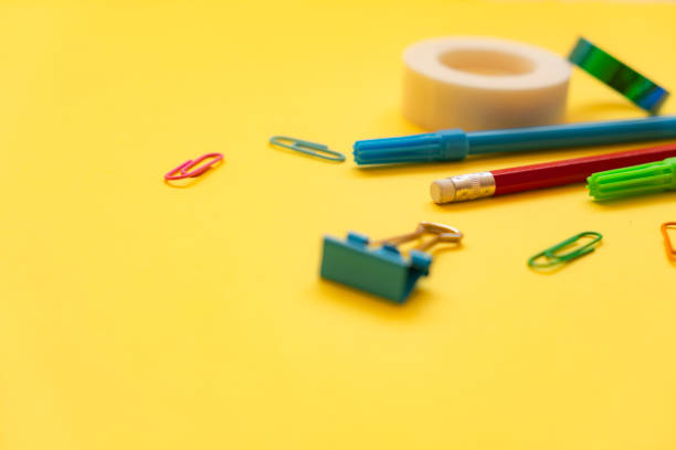 School supplies on yellow background