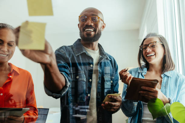 istock Diverse team brainstorming and sharing ideas during a business workshop 2167529308