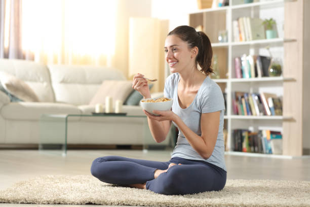istock Yogi eating cereals after doing yoga exercises 2167529711