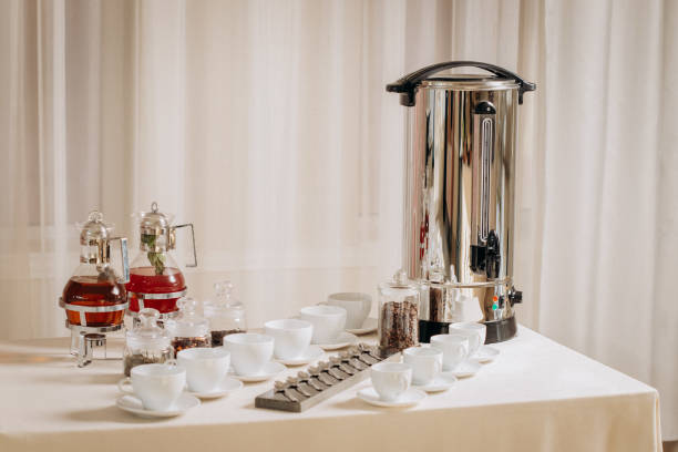 Group of empty white ceramic cups for coffee or tea in outside buffet at the business meeting event Coffee or tea cups on catering table at conference or wedding banquet table coffee station at wedding stock pictures, royalty-free photos & images