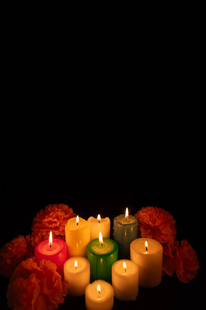 istock A vertical image showcasing glowing candles encircled by marigold flowers 2167531099