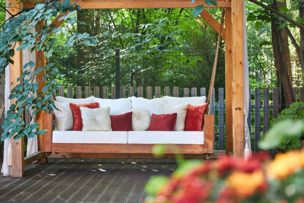 istock veranda with garden swing is decorated with fall decor and chrysanthemums 2167531388
